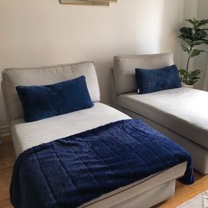 Two blue plush decorative pillows